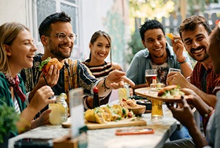 Group of friends enjoying a meal in a restaurant