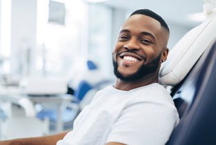 Smiling man in dental treatment chair