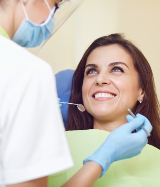 patient smiling in operation chair