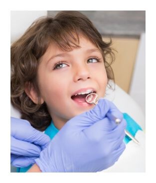 Child receiving dental checkup and teeth cleaning