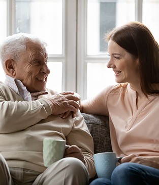 mature father with dentures in Rio Rancho talking to daughter  