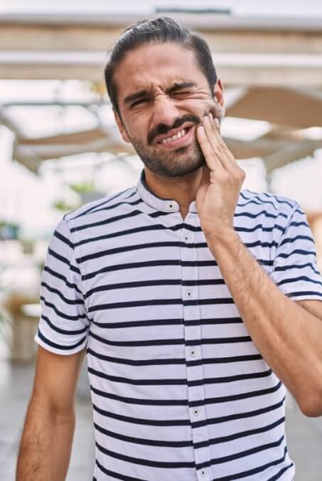 Man in pain before emergency dentistry