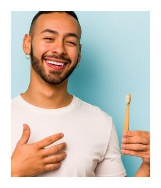 Man brushing teeth to prevent dental emergencies