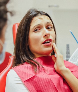 Worried woman in the dental chair