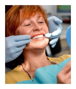 Woman smiling and enjoying the benefits of dental implants