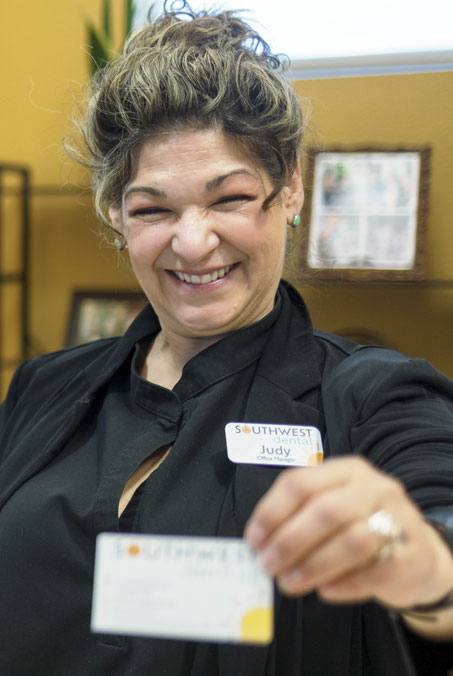 Woman in dental chair smiling