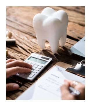 Person calculating dental insurance coverage