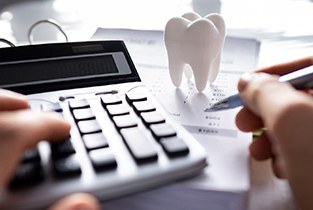 a person calculating the cost of Invisalign