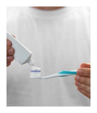 Dental patient using fluoride treatment