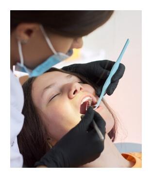 Dental patient receiving treatment under oral conscious sedation dentistry