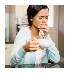 Woman with missing teeth covering her mouth in pain