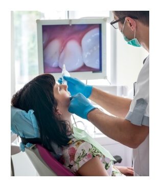 Dentist capturing smile images with an intraoral camera