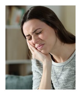 Woman holding jaw before T M J dysfunction diagnosis and treatment planning