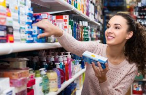 a person shopping for toothpaste