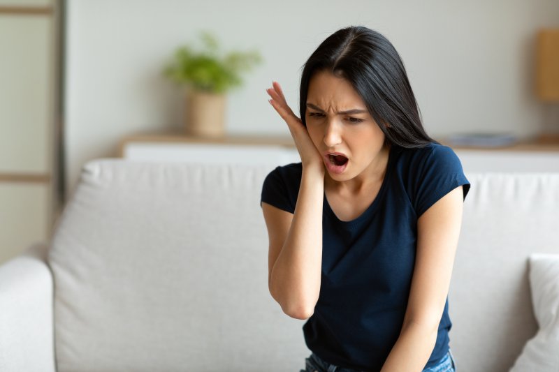 woman experiencing a dental emergency