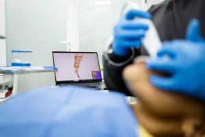 a dentist taking a digital impression of a patient's mouth